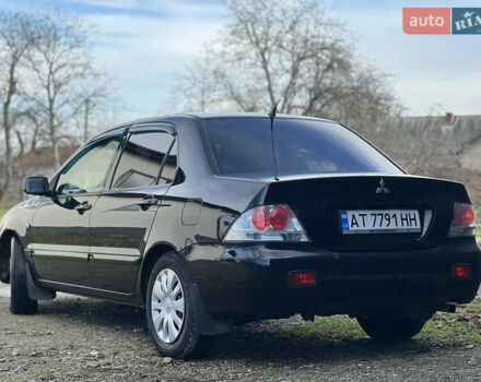 Чорний Міцубісі Lancer, об'ємом двигуна 1.58 л та пробігом 185 тис. км за 3750 $, фото 3 на Automoto.ua