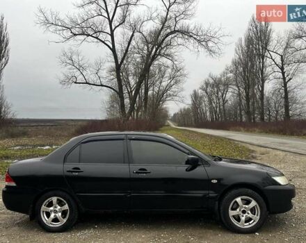 Черный Мицубиси Лансер, объемом двигателя 1.6 л и пробегом 272 тыс. км за 2800 $, фото 4 на Automoto.ua