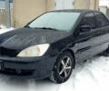 Чорний Міцубісі Lancer, об'ємом двигуна 1.58 л та пробігом 237 тис. км за 4300 $, фото 1 на Automoto.ua