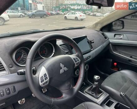 Черный Мицубиси Лансер, объемом двигателя 2 л и пробегом 246 тыс. км за 7500 $, фото 13 на Automoto.ua