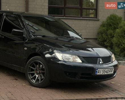 Черный Мицубиси Лансер, объемом двигателя 1.6 л и пробегом 211 тыс. км за 5700 $, фото 1 на Automoto.ua