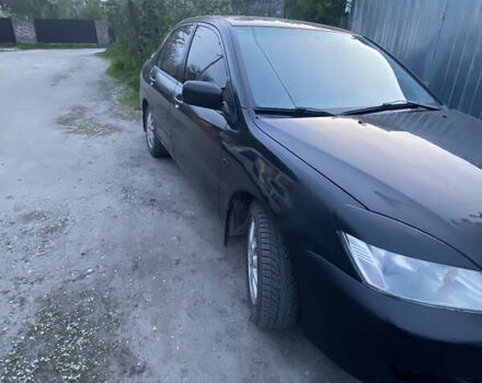 Чорний Міцубісі Lancer, об'ємом двигуна 1.6 л та пробігом 195 тис. км за 5200 $, фото 35 на Automoto.ua