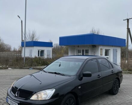 Черный Мицубиси Лансер, объемом двигателя 1.6 л и пробегом 263 тыс. км за 2900 $, фото 1 на Automoto.ua