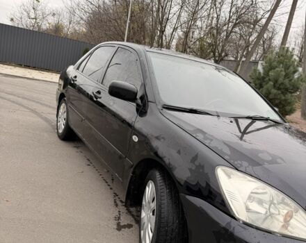 Черный Мицубиси Лансер, объемом двигателя 1.6 л и пробегом 240 тыс. км за 3500 $, фото 2 на Automoto.ua