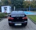 Чорний Міцубісі Lancer, об'ємом двигуна 2 л та пробігом 300 тис. км за 6185 $, фото 3 на Automoto.ua