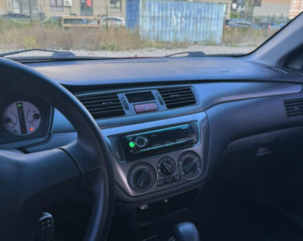 Чорний Міцубісі Lancer, об'ємом двигуна 1.6 л та пробігом 195 тис. км за 5000 $, фото 6 на Automoto.ua