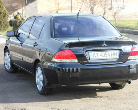 Чорний Міцубісі Lancer, об'ємом двигуна 1.6 л та пробігом 101 тис. км за 4699 $, фото 11 на Automoto.ua