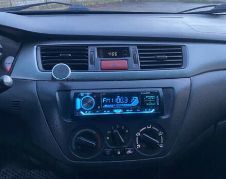 Чорний Міцубісі Lancer, об'ємом двигуна 1.58 л та пробігом 280 тис. км за 3650 $, фото 9 на Automoto.ua