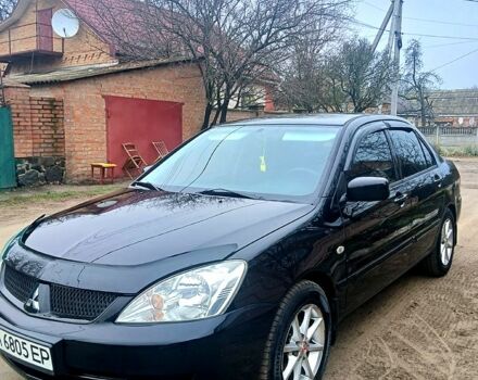 Чорний Міцубісі Lancer, об'ємом двигуна 1.6 л та пробігом 240 тис. км за 4700 $, фото 11 на Automoto.ua
