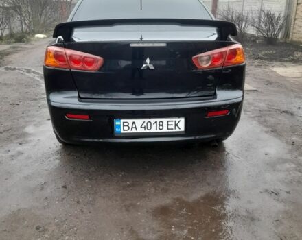 Черный Мицубиси Лансер, объемом двигателя 2 л и пробегом 215 тыс. км за 5700 $, фото 2 на Automoto.ua
