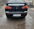 Черный Мицубиси Лансер, объемом двигателя 2 л и пробегом 215 тыс. км за 5700 $, фото 2 на Automoto.ua