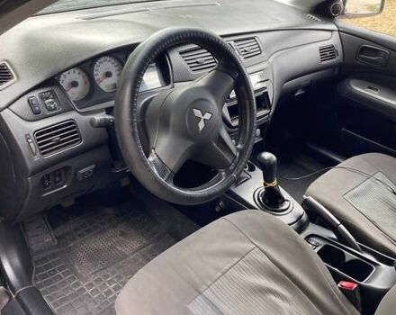 Чорний Міцубісі Lancer, об'ємом двигуна 1.58 л та пробігом 231 тис. км за 4300 $, фото 4 на Automoto.ua