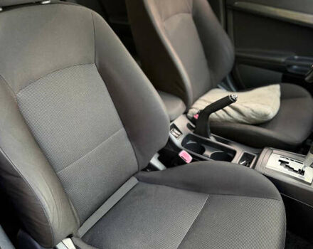 Черный Мицубиси Лансер, объемом двигателя 2 л и пробегом 219 тыс. км за 6400 $, фото 9 на Automoto.ua