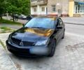 Черный Мицубиси Лансер, объемом двигателя 1.6 л и пробегом 235 тыс. км за 3750 $, фото 1 на Automoto.ua
