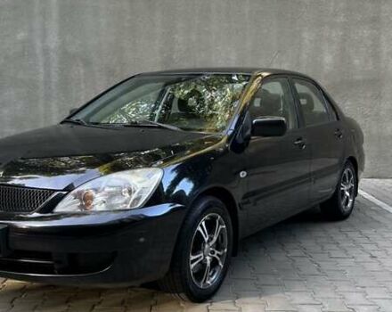 Чорний Міцубісі Lancer, об'ємом двигуна 1.58 л та пробігом 135 тис. км за 4100 $, фото 10 на Automoto.ua