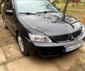 Черный Мицубиси Лансер, объемом двигателя 1.6 л и пробегом 222 тыс. км за 4000 $, фото 1 на Automoto.ua