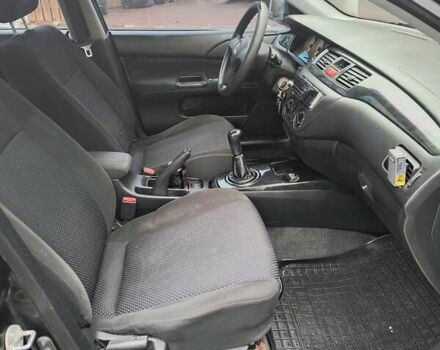 Черный Мицубиси Лансер, объемом двигателя 1.6 л и пробегом 309 тыс. км за 4000 $, фото 5 на Automoto.ua