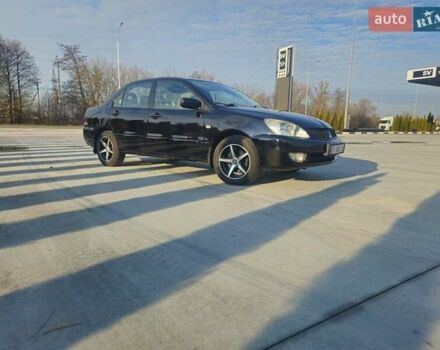 Чорний Міцубісі Lancer, об'ємом двигуна 1.59 л та пробігом 180 тис. км за 4999 $, фото 1 на Automoto.ua