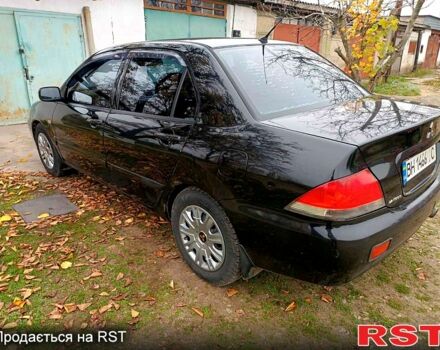 Чорний Міцубісі Lancer, об'ємом двигуна 1.6 л та пробігом 227 тис. км за 4100 $, фото 6 на Automoto.ua