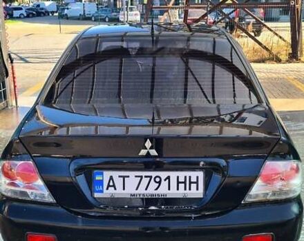 Черный Мицубиси Лансер, объемом двигателя 1.6 л и пробегом 185 тыс. км за 3300 $, фото 4 на Automoto.ua