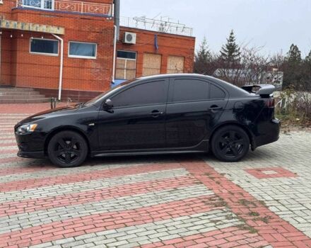 Черный Мицубиси Лансер, объемом двигателя 2 л и пробегом 217 тыс. км за 5500 $, фото 3 на Automoto.ua