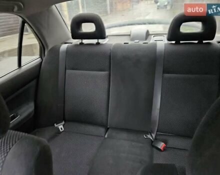 Черный Мицубиси Лансер, объемом двигателя 1.6 л и пробегом 152 тыс. км за 4999 $, фото 10 на Automoto.ua