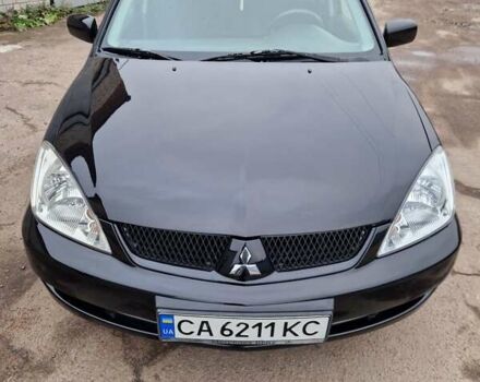 Чорний Міцубісі Lancer, об'ємом двигуна 1.6 л та пробігом 273 тис. км за 3999 $, фото 1 на Automoto.ua