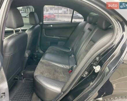 Черный Мицубиси Лансер, объемом двигателя 2 л и пробегом 246 тыс. км за 7500 $, фото 17 на Automoto.ua