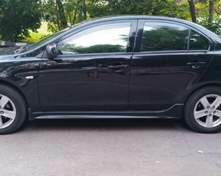 Черный Мицубиси Лансер, объемом двигателя 2 л и пробегом 210 тыс. км за 6000 $, фото 7 на Automoto.ua