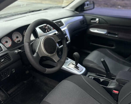 Черный Мицубиси Лансер, объемом двигателя 2 л и пробегом 260 тыс. км за 5300 $, фото 8 на Automoto.ua