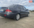 Чорний Міцубісі Lancer, об'ємом двигуна 1.6 л та пробігом 162 тис. км за 4650 $, фото 6 на Automoto.ua