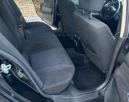 Черный Мицубиси Лансер, объемом двигателя 1.59 л и пробегом 269 тыс. км за 4999 $, фото 13 на Automoto.ua