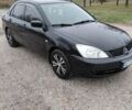 Чорний Міцубісі Lancer, об'ємом двигуна 1.58 л та пробігом 201 тис. км за 4500 $, фото 1 на Automoto.ua
