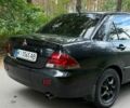 Черный Мицубиси Лансер, объемом двигателя 1.6 л и пробегом 326 тыс. км за 4000 $, фото 1 на Automoto.ua