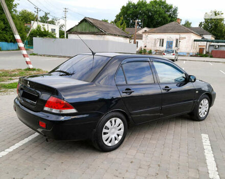 Чорний Міцубісі Lancer, об'ємом двигуна 1.58 л та пробігом 222 тис. км за 4350 $, фото 9 на Automoto.ua