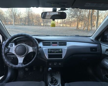 Черный Мицубиси Лансер, объемом двигателя 2 л и пробегом 300 тыс. км за 3999 $, фото 8 на Automoto.ua