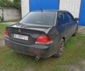Чорний Міцубісі Lancer, об'ємом двигуна 1.6 л та пробігом 175 тис. км за 5300 $, фото 6 на Automoto.ua