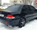 Чорний Міцубісі Lancer, об'ємом двигуна 1.58 л та пробігом 237 тис. км за 4300 $, фото 2 на Automoto.ua