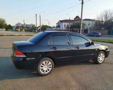 Черный Мицубиси Лансер, объемом двигателя 1.6 л и пробегом 32 тыс. км за 9000 $, фото 13 на Automoto.ua