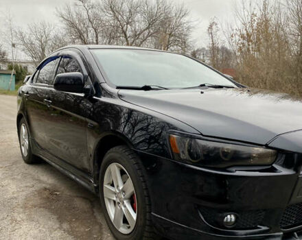 Черный Мицубиси Лансер, объемом двигателя 2 л и пробегом 164 тыс. км за 8300 $, фото 7 на Automoto.ua