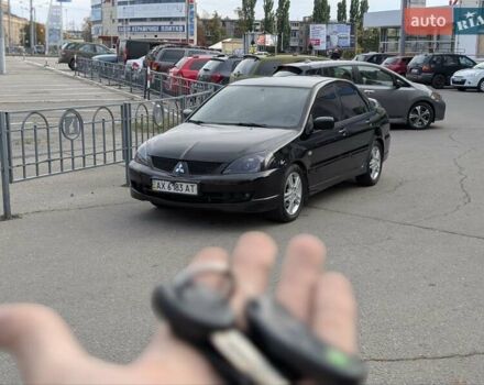 Чорний Міцубісі Lancer, об'ємом двигуна 2 л та пробігом 152 тис. км за 5500 $, фото 32 на Automoto.ua