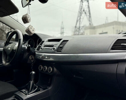 Черный Мицубиси Лансер, объемом двигателя 2 л и пробегом 215 тыс. км за 5500 $, фото 14 на Automoto.ua