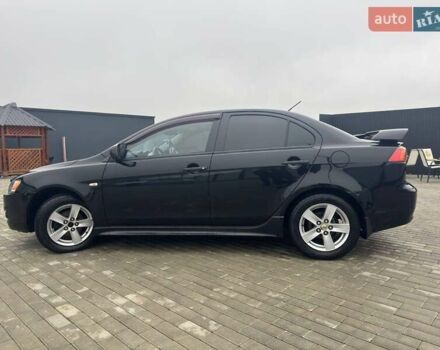 Черный Мицубиси Лансер, объемом двигателя 2 л и пробегом 259 тыс. км за 6500 $, фото 2 на Automoto.ua