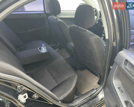 Черный Мицубиси Лансер, объемом двигателя 2 л и пробегом 200 тыс. км за 6199 $, фото 8 на Automoto.ua