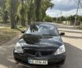 Черный Мицубиси Лансер, объемом двигателя 1.6 л и пробегом 244 тыс. км за 4500 $, фото 3 на Automoto.ua