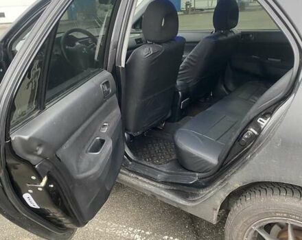 Черный Мицубиси Лансер, объемом двигателя 1.58 л и пробегом 263 тыс. км за 4000 $, фото 29 на Automoto.ua