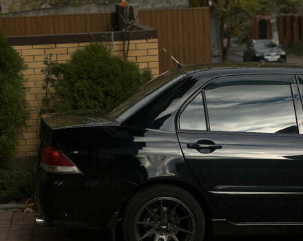 Черный Мицубиси Лансер, объемом двигателя 1.6 л и пробегом 211 тыс. км за 5700 $, фото 21 на Automoto.ua