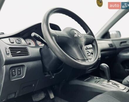 Чорний Міцубісі Lancer, об'ємом двигуна 1.6 л та пробігом 243 тис. км за 4950 $, фото 36 на Automoto.ua