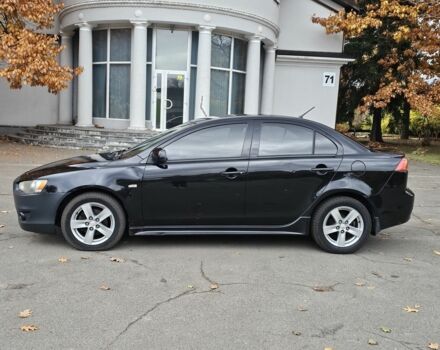 Черный Мицубиси Лансер, объемом двигателя 2 л и пробегом 115 тыс. км за 5000 $, фото 3 на Automoto.ua