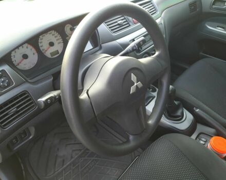 Черный Мицубиси Лансер, объемом двигателя 1.6 л и пробегом 32 тыс. км за 9000 $, фото 19 на Automoto.ua